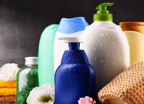 Close-up of plastic bottles of body care and beauty products